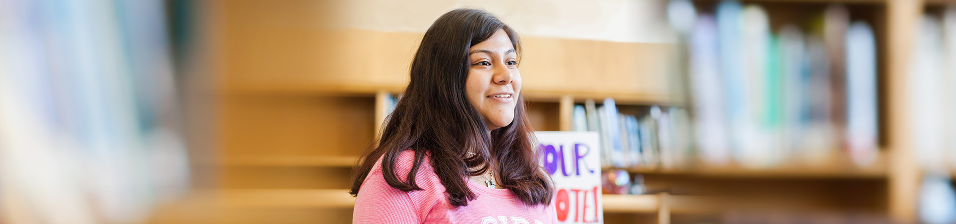  High school Girl Scout senior ambassador public speaking at school 