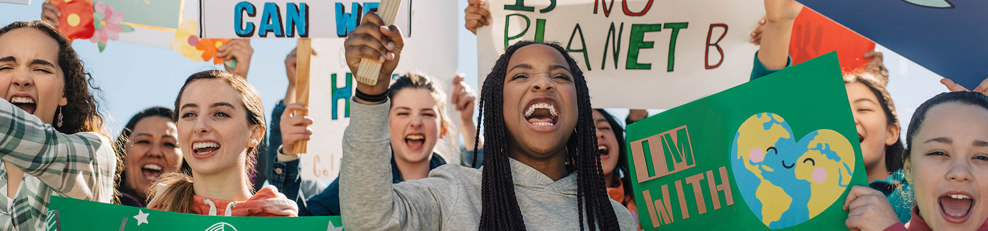  A group of older Girl Scouts protesting climate change 